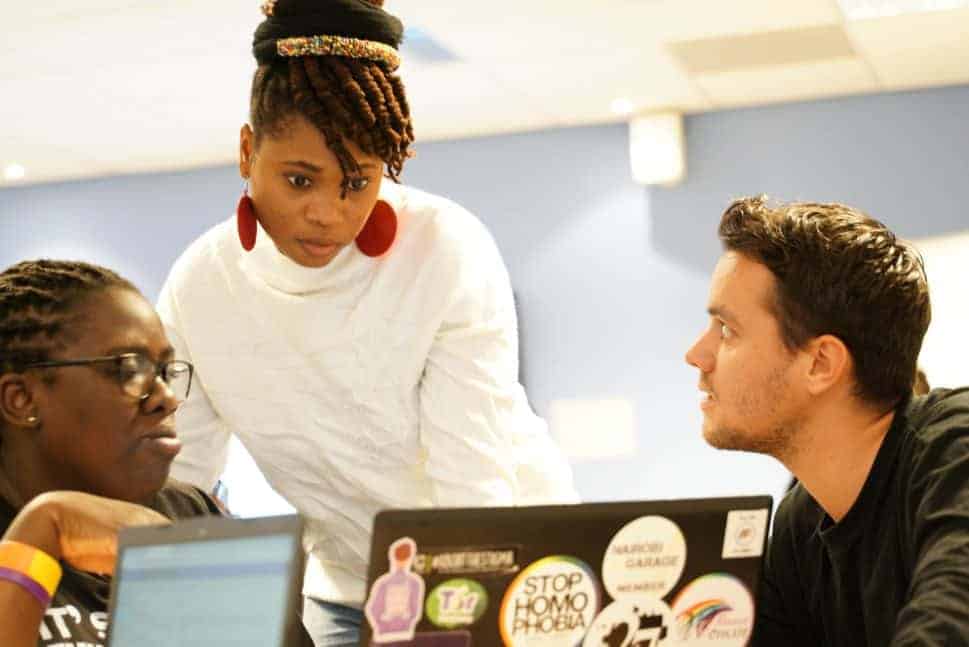 Mand women discussing in class RNTC training